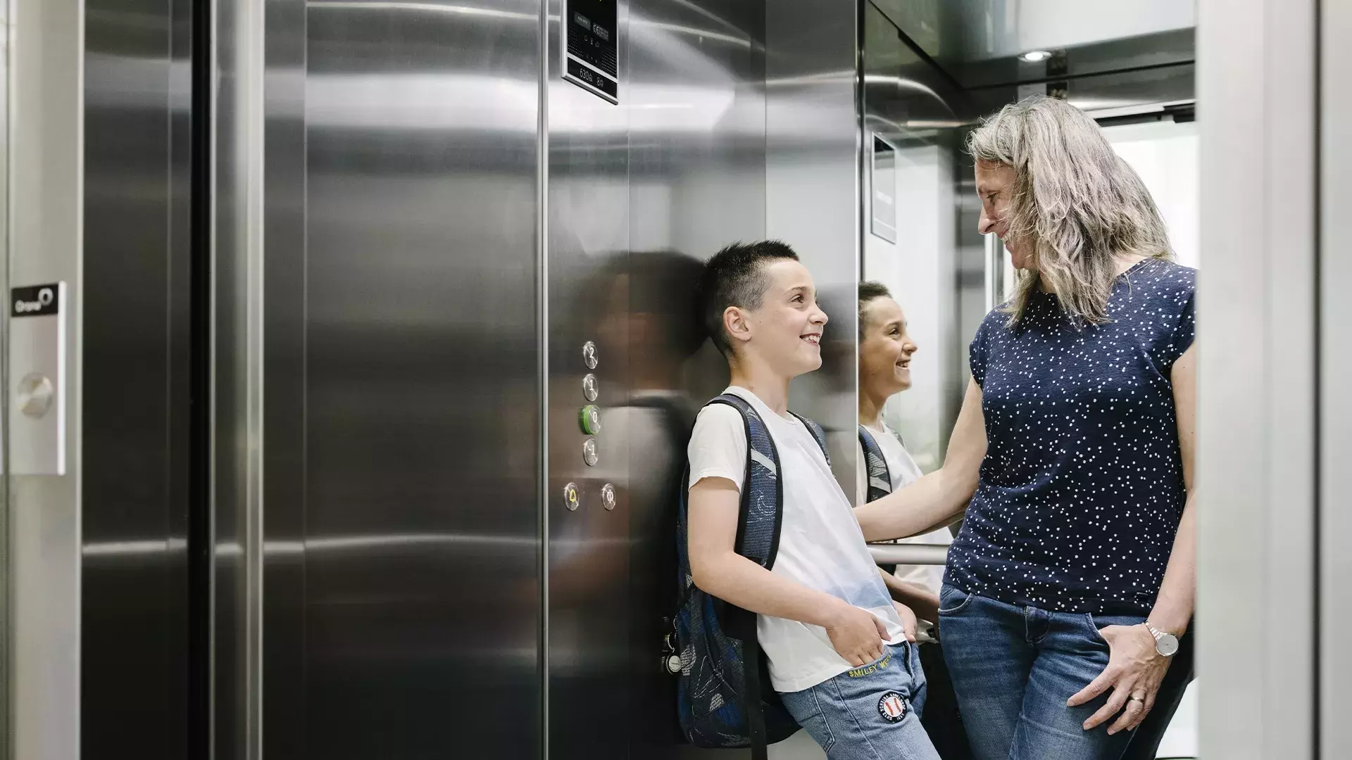 Mother and her child in a lift