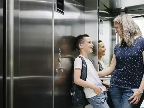 Mother and her child in a lift